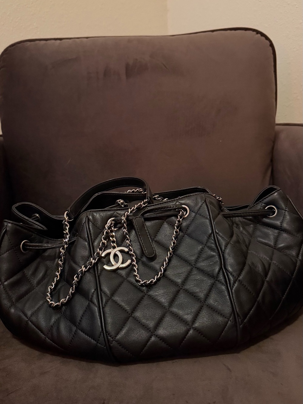 CHANEL Black Quilted Leather Drawstring Shoulder Bag with CC Charm